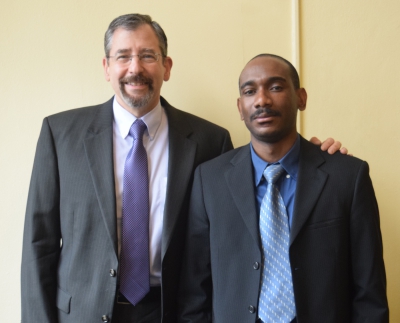Catholic Charities’ Executive Director Mike Melara (left) and Love Mouity